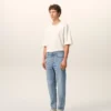 Jeans blu in cotone a vestibilità affusolata Jeans blu in cotone a vestibilità affusolata