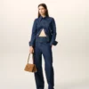 Jeans blu in cotone con cintura avvolgente e vestibilità a palloncino Jeans blu in cotone con cintura avvolgente e vestibilità a palloncino