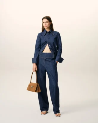 Jeans blu in cotone con cintura avvolgente e vestibilità a palloncino Jeans blu in cotone con cintura avvolgente e vestibilità a palloncino