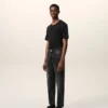 Jeans in cotone nero dal taglio affusolato Jeans in cotone nero dal taglio affusolato