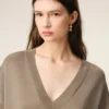 Maglia a maniche corte in lana beige con scollo a V Maglia a maniche corte in lana beige con scollo a V