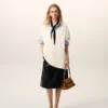 Maglia bianca in lana a maniche corte con scollo a V Maglia bianca in lana a maniche corte con scollo a V