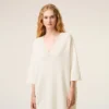 Maglia bianca in lana a maniche corte con scollo a V Maglia bianca in lana a maniche corte con scollo a V