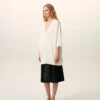 Maglia bianca in lana a maniche corte con scollo a V Maglia bianca in lana a maniche corte con scollo a V