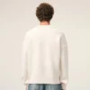 Maglione girocollo in lana naturale con Ami de Coeur a contrasto Maglione girocollo in lana naturale con Ami de Coeur a contrasto