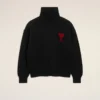 Maglione nero in lana con collo a imbuto e Ami de Coeur a contrasto Maglione nero in lana con collo a imbuto e Ami de Coeur a contrasto