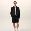 Giacca Ami de Coeur in nylon nero con bottoni a pressione Giacca Ami de Coeur in nylon nero con bottoni a pressione