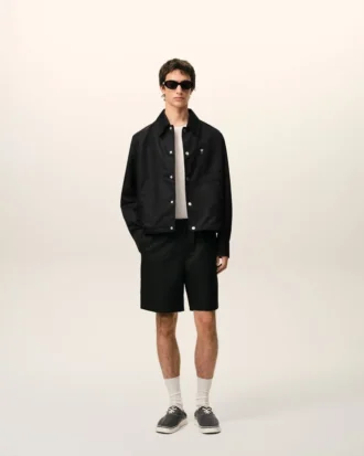 Pantaloncini Ami de Coeur in nylon nero con elastico in vita e borchie