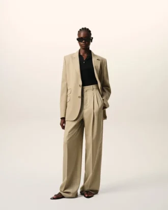 Pantaloni beige in lana vergine a vita alta e gamba larga