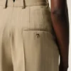 Pantaloni beige in lana vergine a vita alta e gamba larga