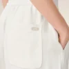 Pantaloni bianchi in misto lino con elastico in vita