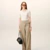 Pantaloni con cintura avvolgente in cotone beige Pantaloni con cintura avvolgente in cotone beige