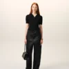 Pantaloni con cintura in raso nero e fibbia