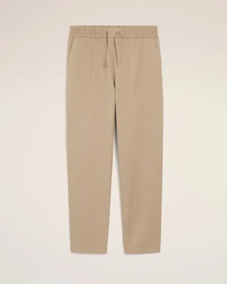 Pantaloni in cotone beige con elastico in vita
