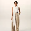 Pantaloni larghi a vita alta in lana vergine beige con due pieghe