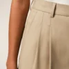 Pantaloni larghi a vita alta in lana vergine beige con due pieghe