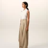 Pantaloni larghi a vita alta in lana vergine beige con due pieghe