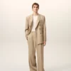 Pantaloni larghi a vita bassa in lana vergine beige