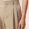 Pantaloni larghi a vita bassa in lana vergine beige