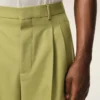 Pantaloni larghi a vita bassa in lana vergine verde