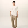 Pantaloni oversize a carota in cotone beige Pantaloni oversize a carota in cotone beige