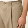 Pantaloni oversize a carota in cotone beige Pantaloni oversize a carota in cotone beige