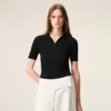 Polo a maniche corte in maglia nera Polo a maniche corte in maglia nera
