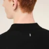 Polo a maniche corte in maglia nera Polo a maniche corte in maglia nera