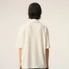 Polo con toppa in maglia di cotone bianco Ami de Coeur