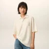 Polo con toppa in maglia di cotone bianco Ami de Coeur