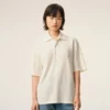 Polo con toppa in maglia di cotone bianco Ami de Coeur