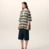 Polo in cotone con patch Ami a righe blu