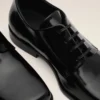 Scarpe derby in pelle di vacchetta nera Scarpe derby in pelle di vacchetta nera