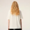 T-shirt bianca in cotone con stampa distintiva T-shirt bianca in cotone con stampa distintiva