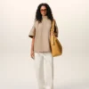 Top Ami De Coeur in cotone beige con colletto rialzato e bottoni Top Ami De Coeur in cotone beige con colletto rialzato e bottoni