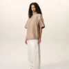 Top Ami De Coeur in cotone beige con colletto rialzato e bottoni Top Ami De Coeur in cotone beige con colletto rialzato e bottoni
