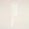 Top bianco senza maniche in jersey con scollo lavallière Top bianco senza maniche in jersey con scollo lavallière